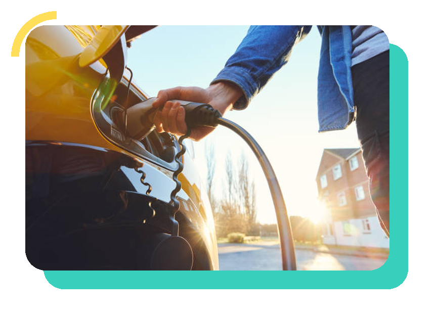 Hand plugging a charging cable into an electric car at sunset, in a Solar Heaven teal frame
